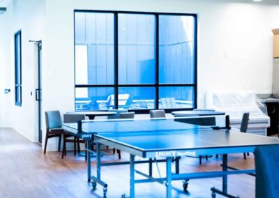 room with ping pong tables in a recreational room